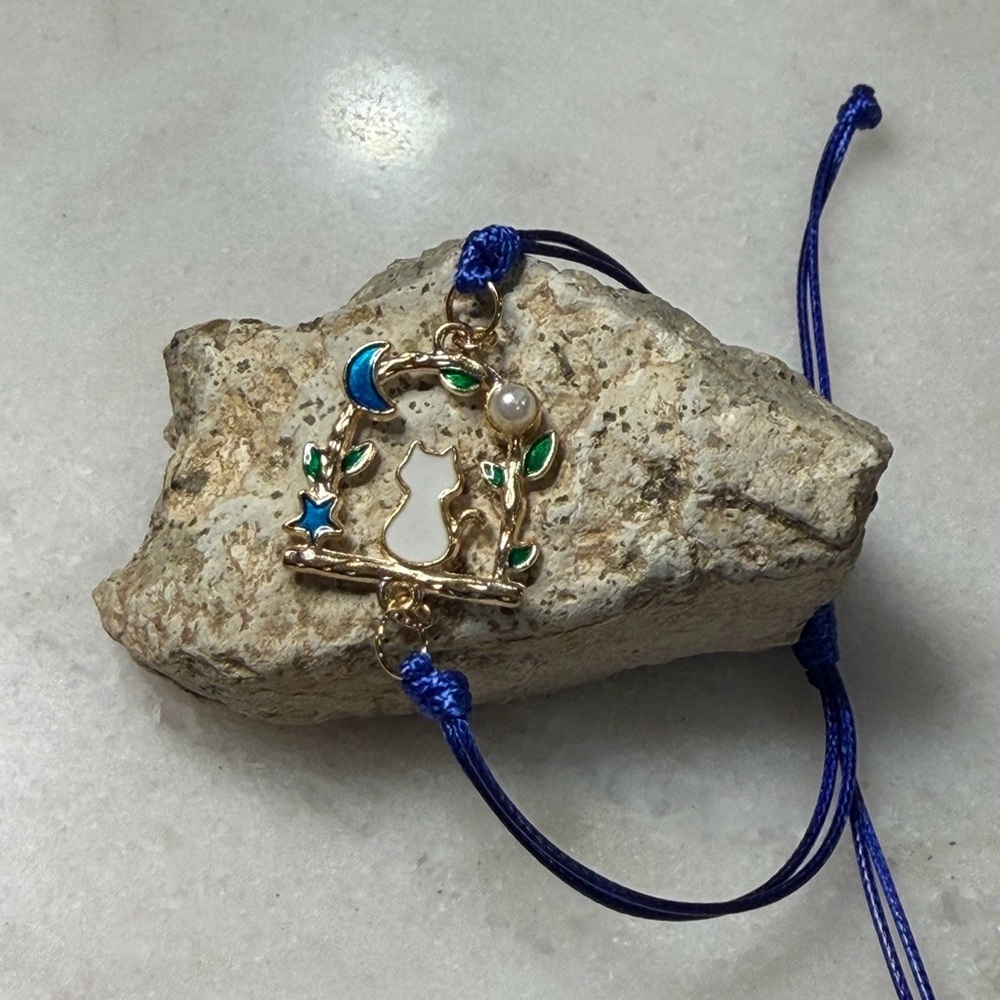 Gold-Tone Cat Pendant Bracelet with Blue Cord